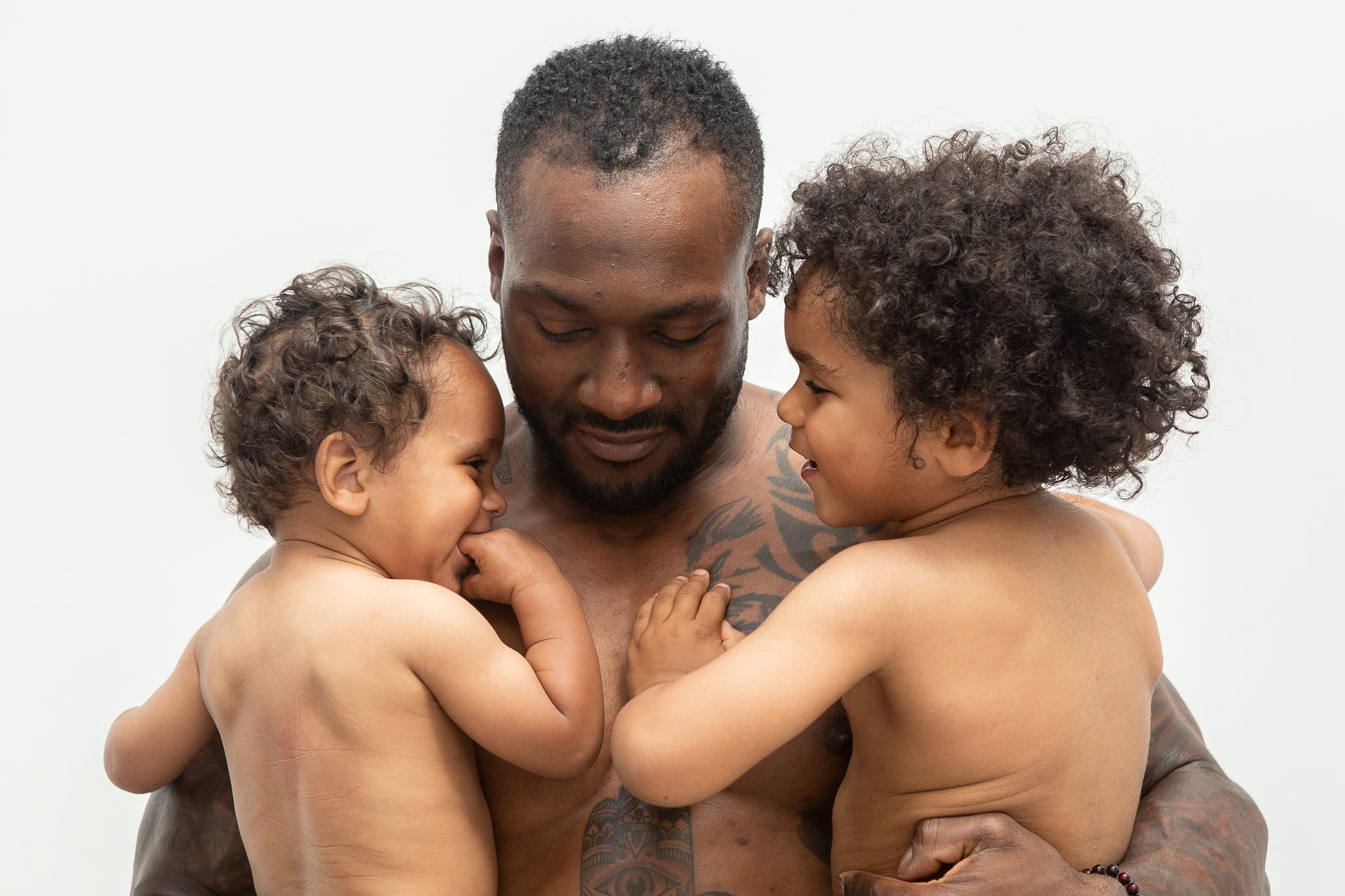 Studio family photography of dad holding his two sons