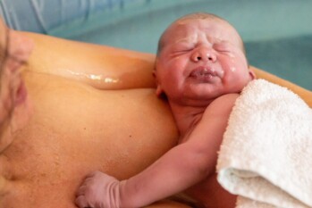 newborn baby on his mother's chest minutes after being born